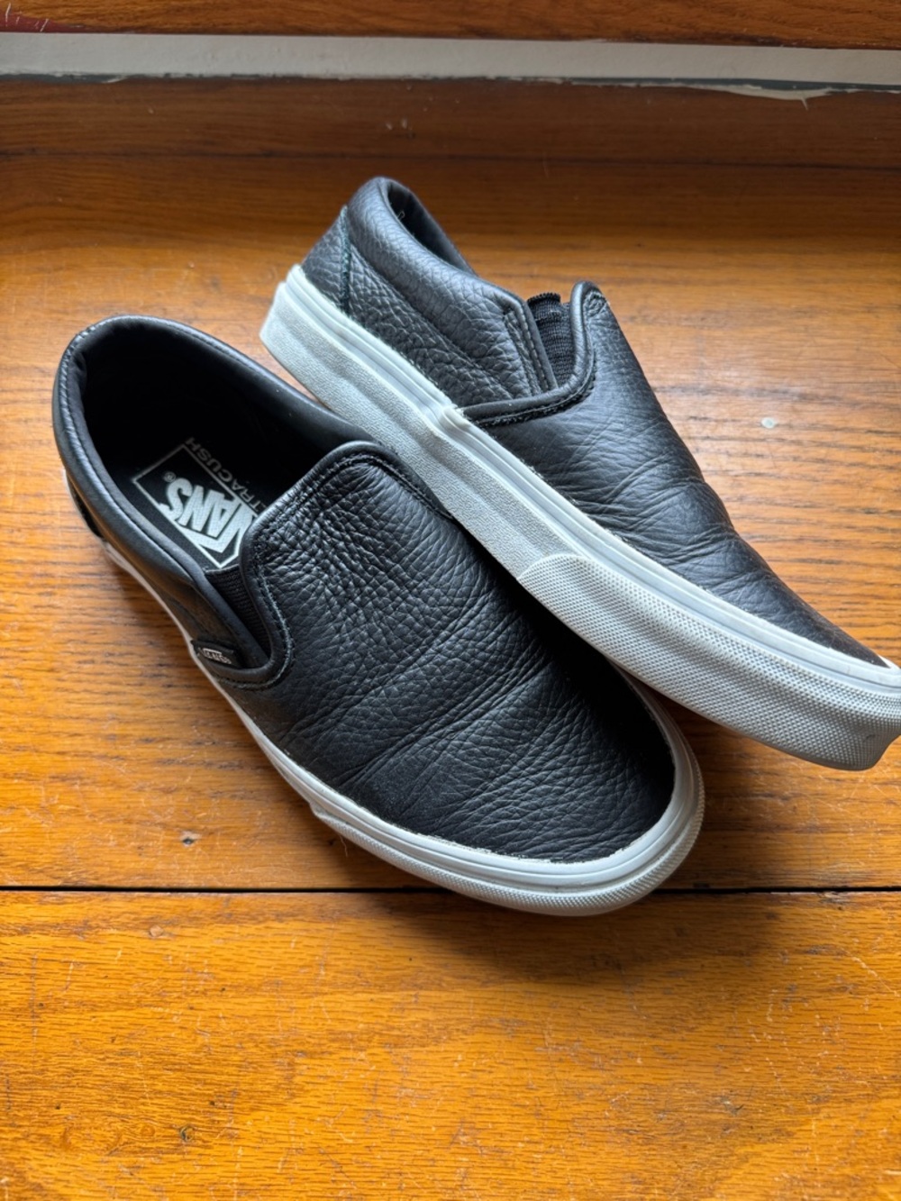 Vans Slip-On Leather Sneakers in Black and White